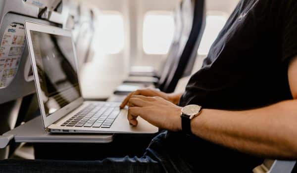 person typing on laptop.